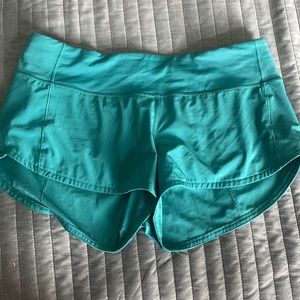 Teal Lululemon “speed up” shorts